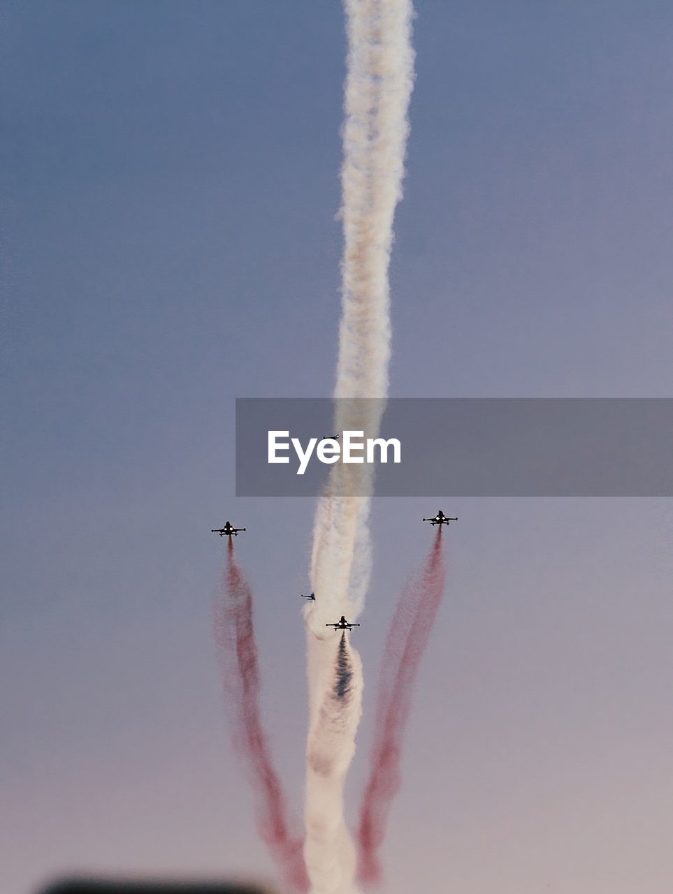 Low angle view of airshow against sky