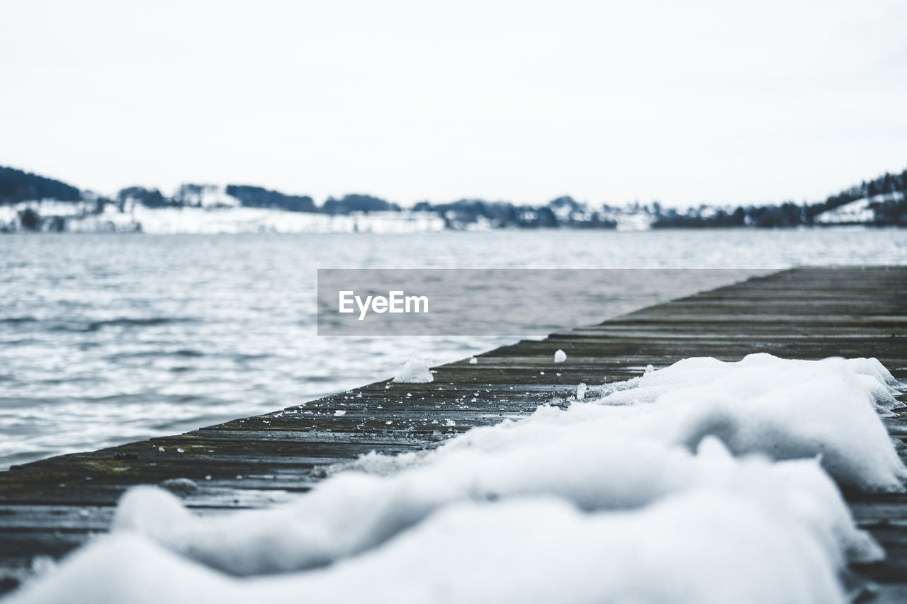 Scenic view of sea against sky during winter