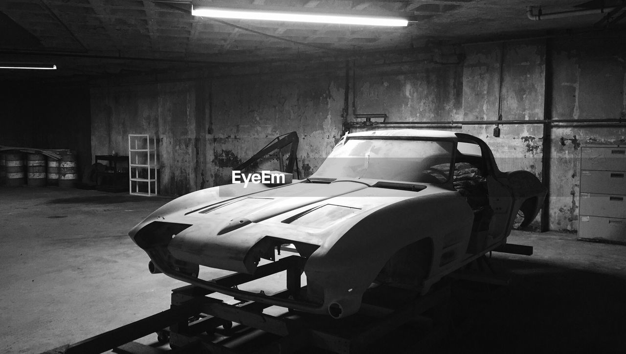 abandoned, indoors, built structure, no people, illuminated, architecture, auto repair shop, parking garage, day