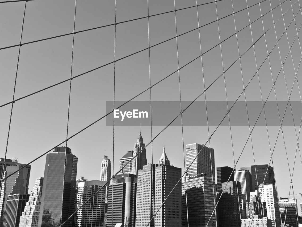 Low angle view of tall buildings against clear sky