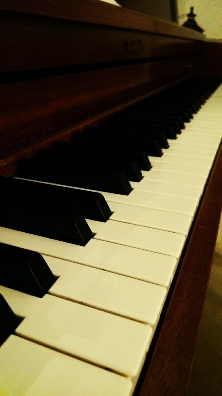 CLOSE-UP OF PIANO KEYS