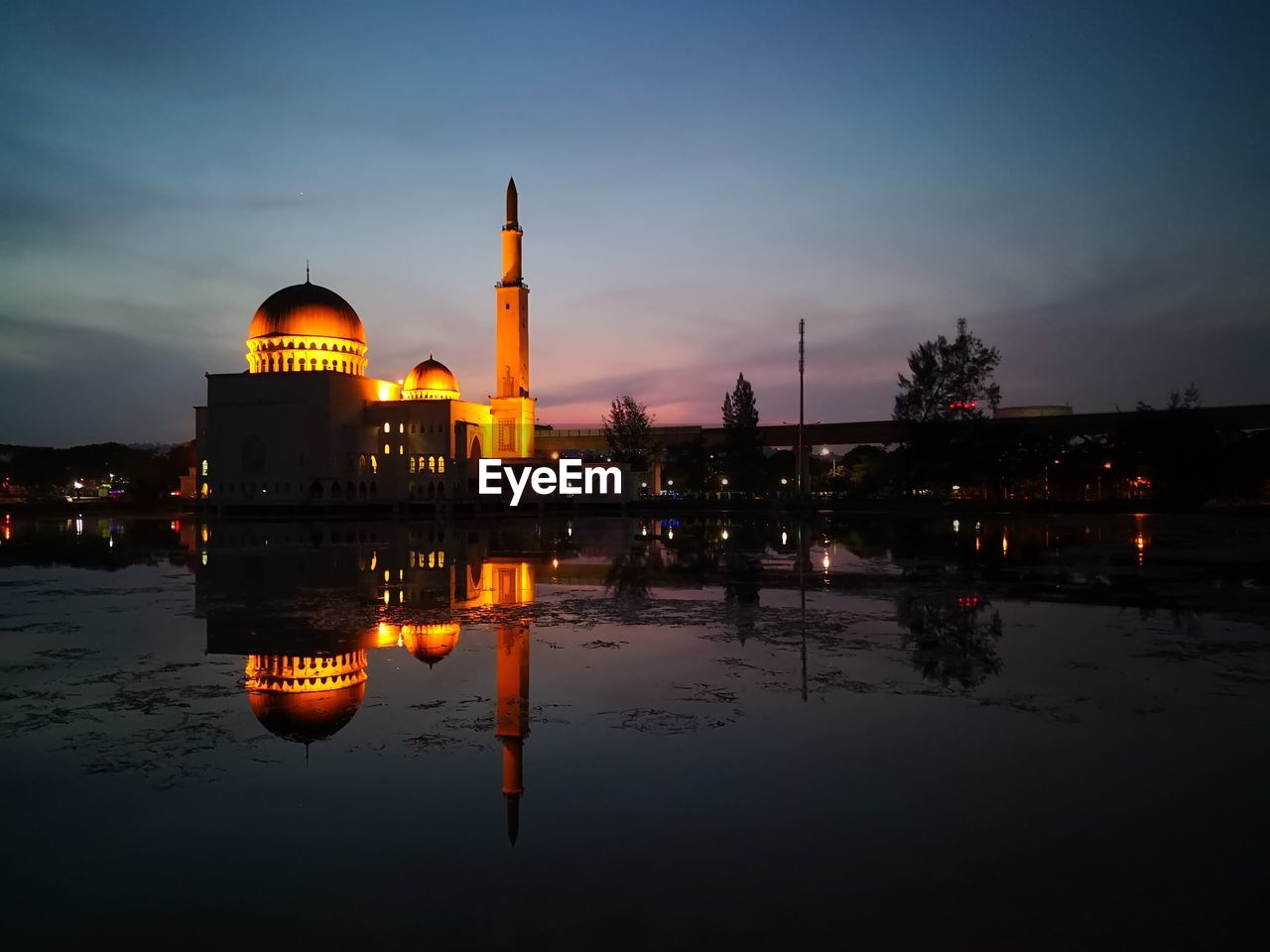 ILLUMINATED MOSQUE AT NIGHT