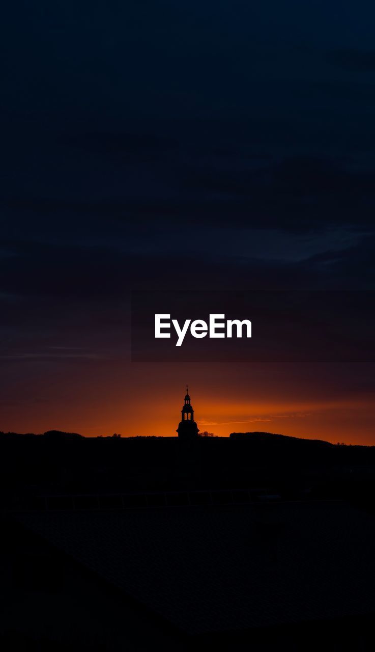 SILHOUETTE OF TEMPLE AGAINST SKY DURING SUNSET