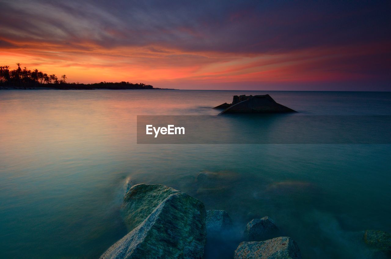 Scenic view of sea against sky during sunset