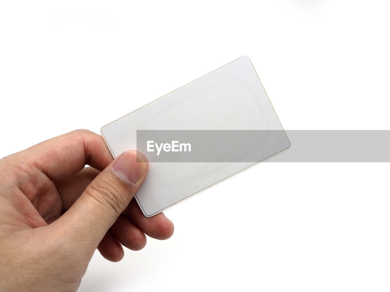 Cropped hand holding business card against white background