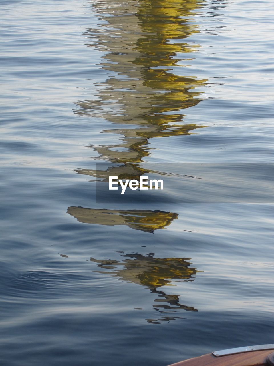 CLOSE-UP OF REFLECTION OF WATER IN PUDDLE