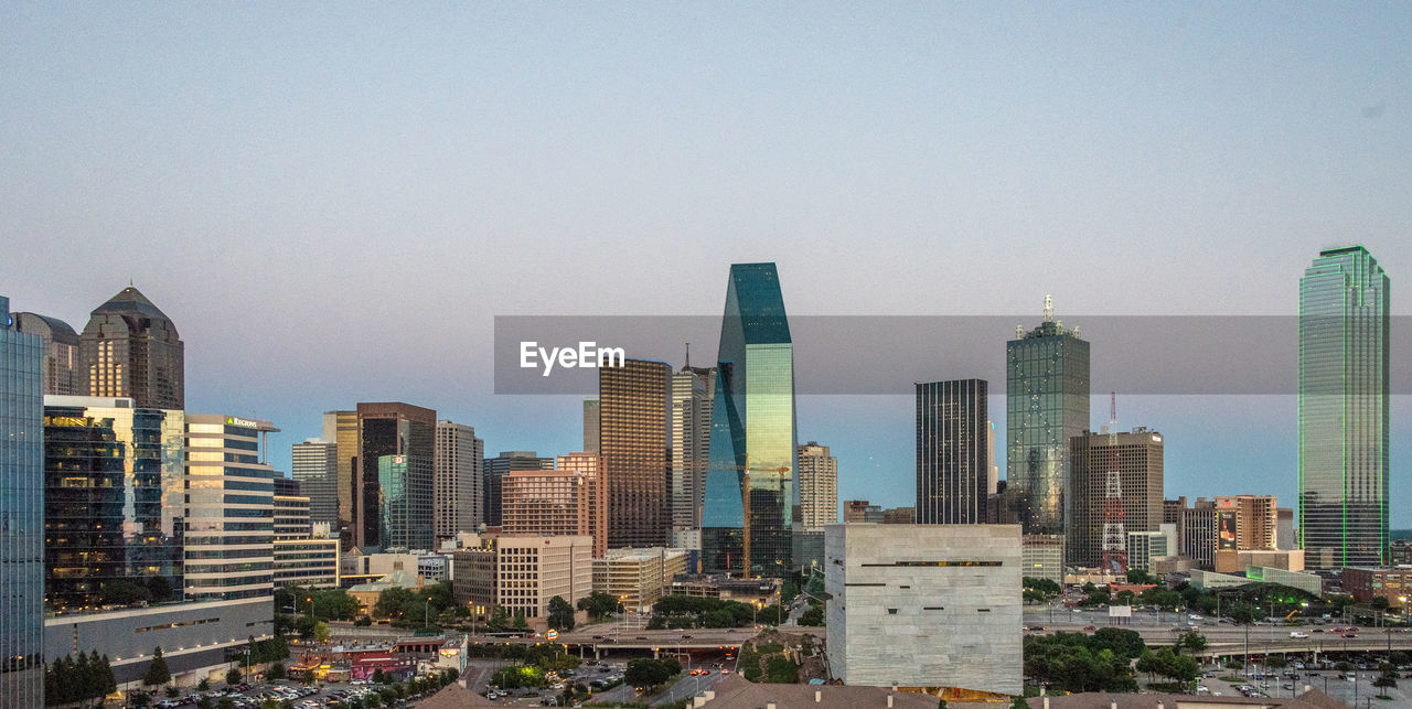 Modern buildings against sky in city