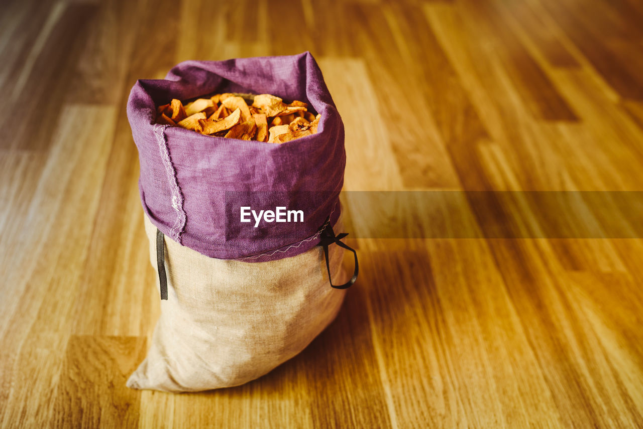 Close-up of food in purple sack on table