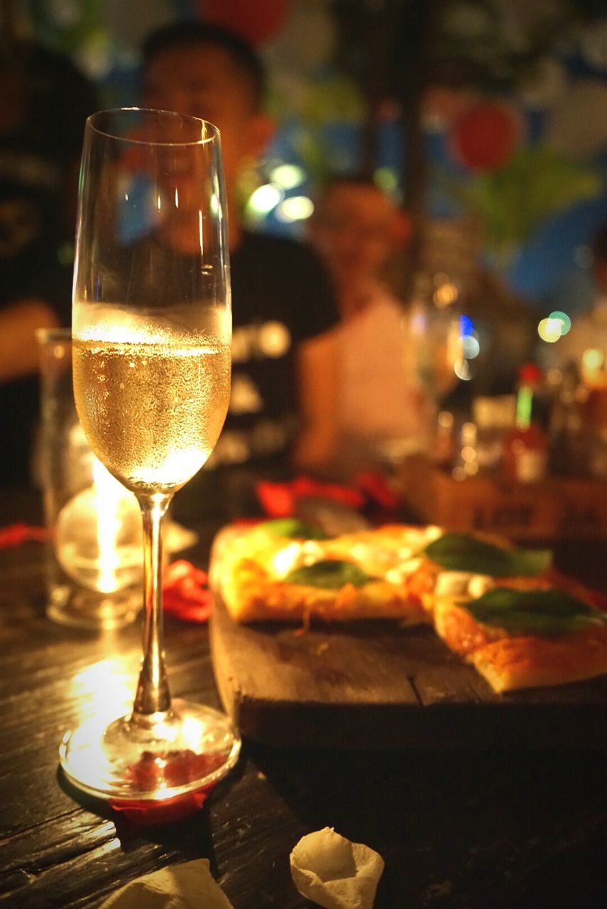 Close-up of champagne and food on table at restaurant