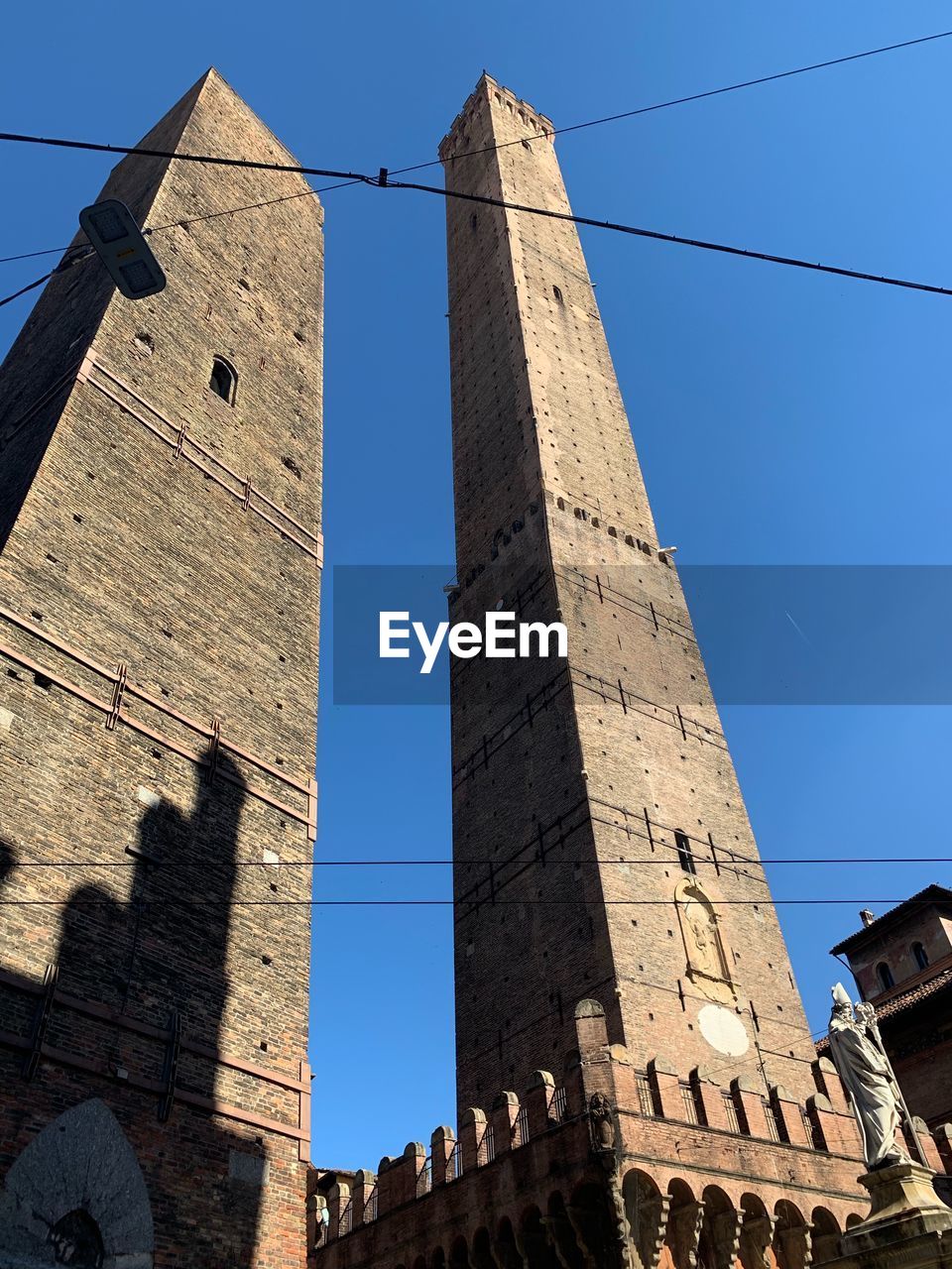 Low angle view of historic building against clear blue sky