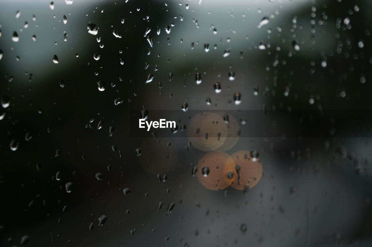 CLOSE-UP OF WET GLASS WINDOW