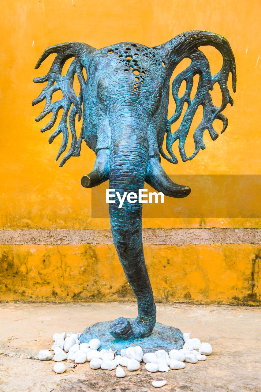 CLOSE-UP OF ELEPHANT STATUE