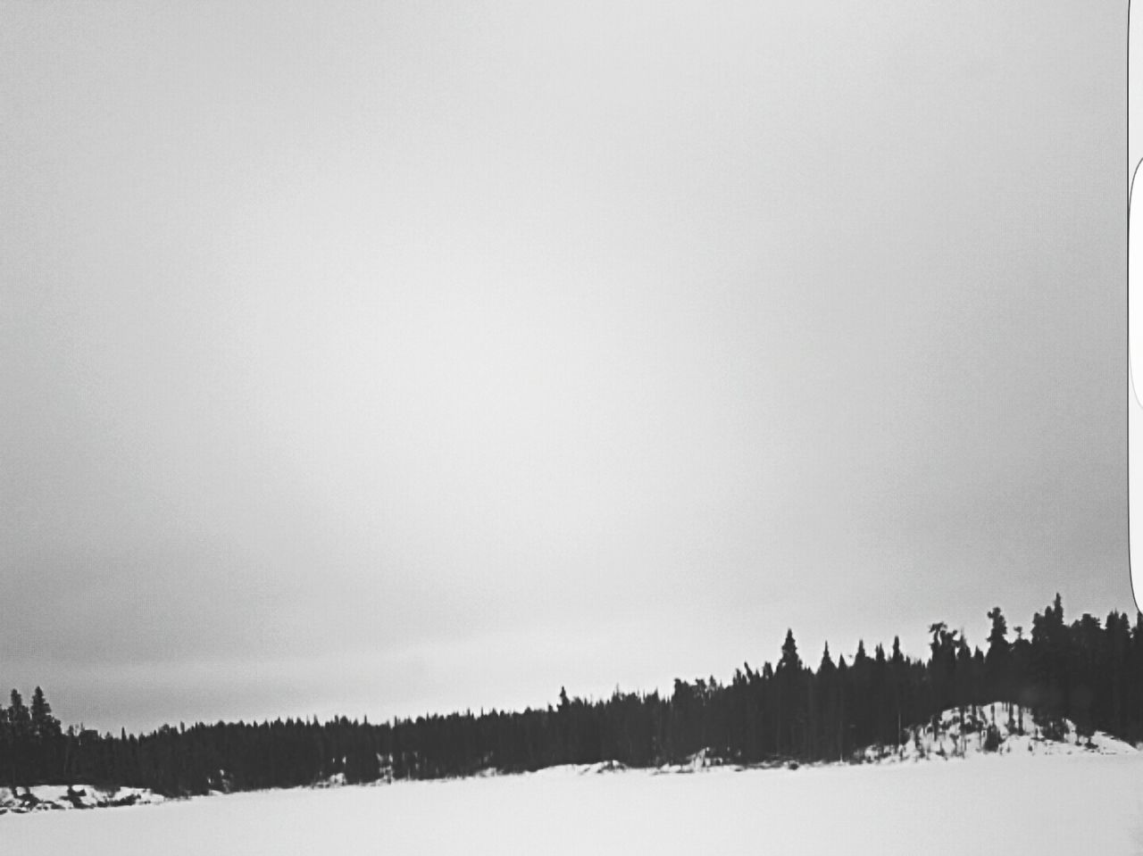 PANORAMIC VIEW OF SNOW COVERED LANDSCAPE