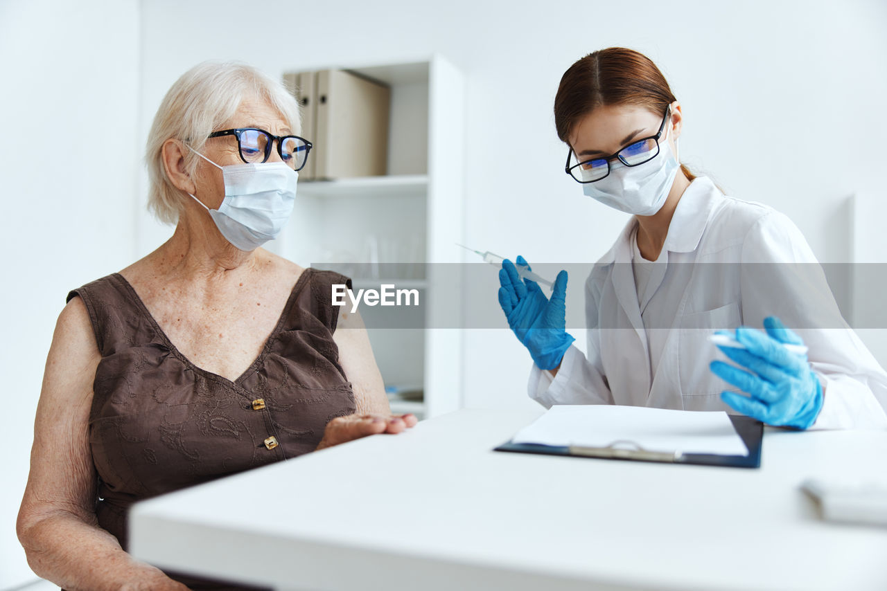 VIEW OF TWO WOMEN WEARING EYEGLASSES