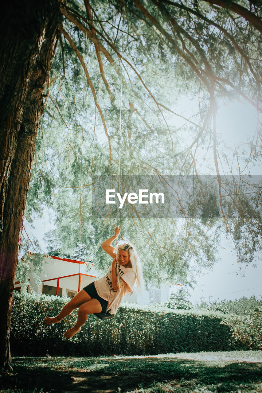 Woman playing on swing