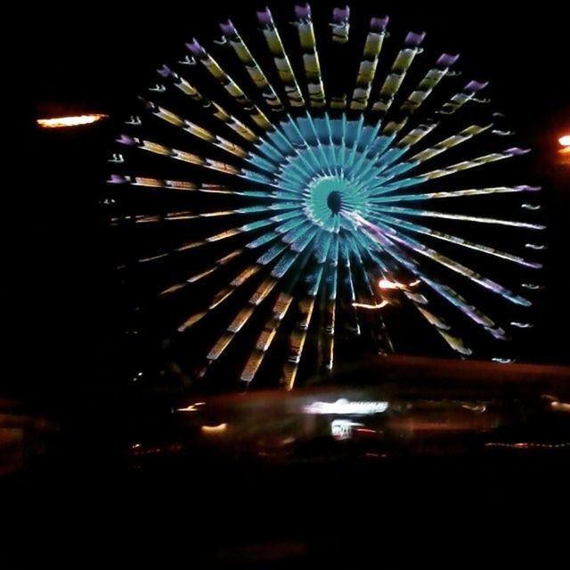 LOW ANGLE VIEW OF FIREWORKS DISPLAY