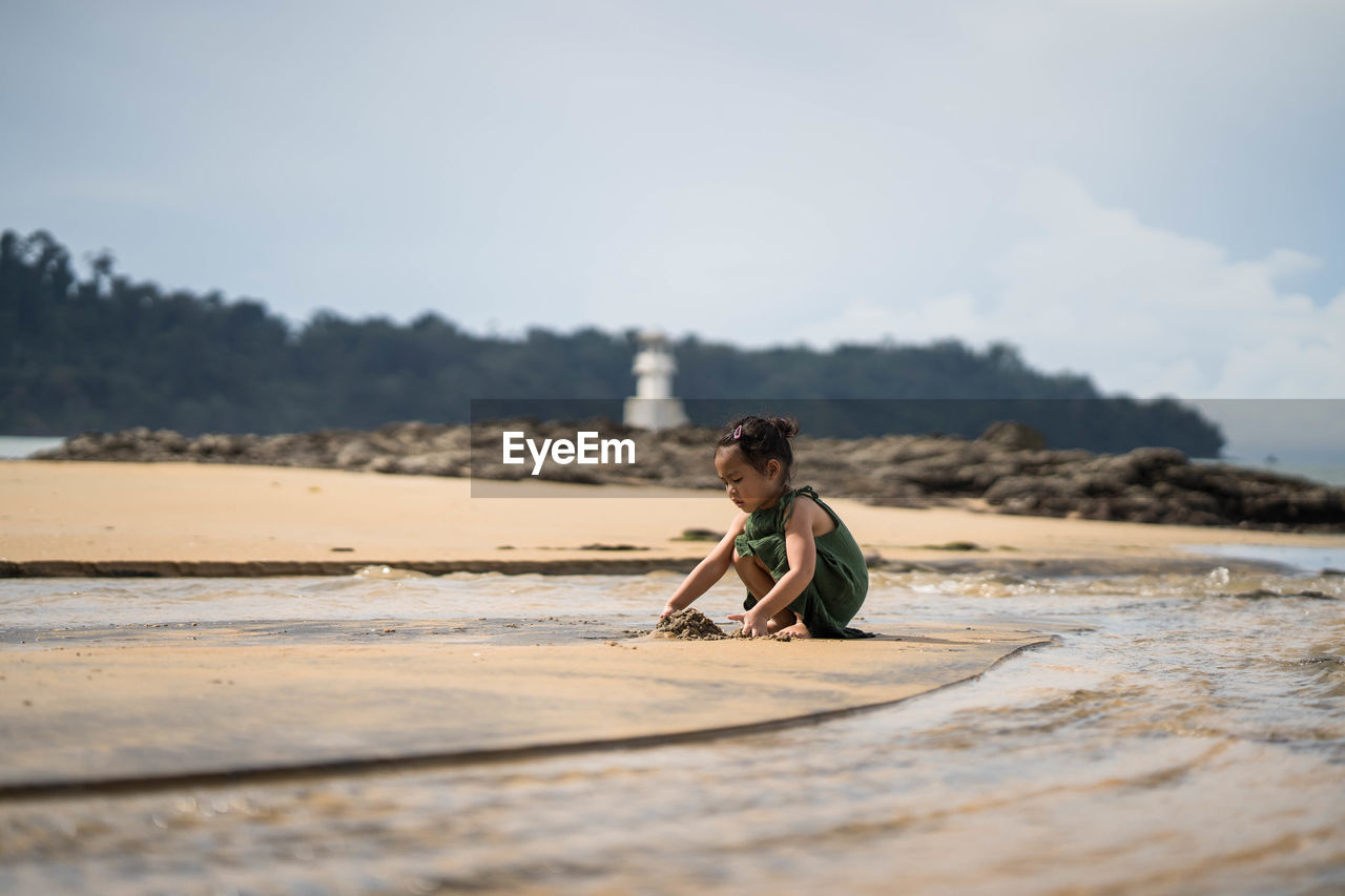 Full length of girl on beach