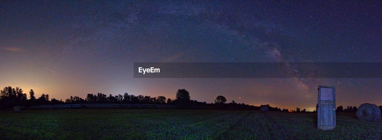 SCENIC VIEW OF FIELD AT NIGHT