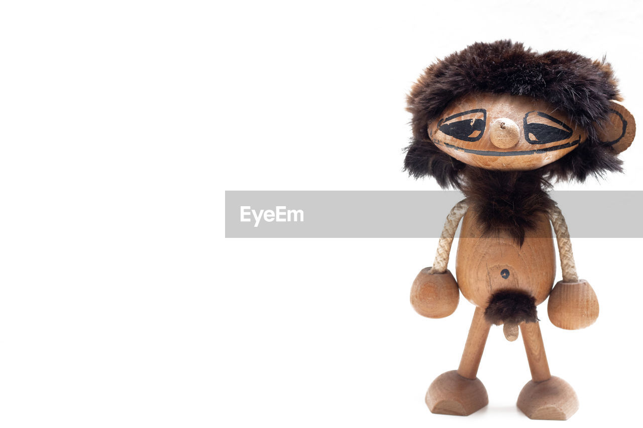 toy, brown, cartoon, white background, copy space, cut out, studio shot, monkey, stuffed toy, indoors, fun, representation, no people, doll, animal, mammal, primate, human representation, figurine, cute, wood
