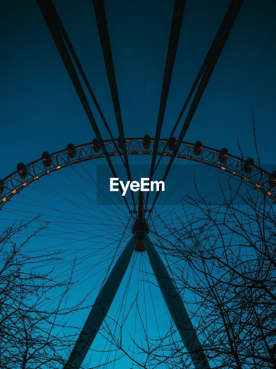 LOW ANGLE VIEW OF FERRIS WHEEL AGAINST SKY