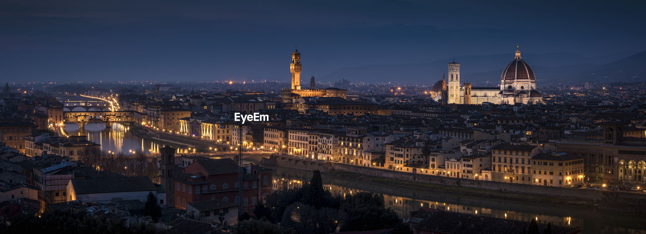 Aerial view of illuminated city at night