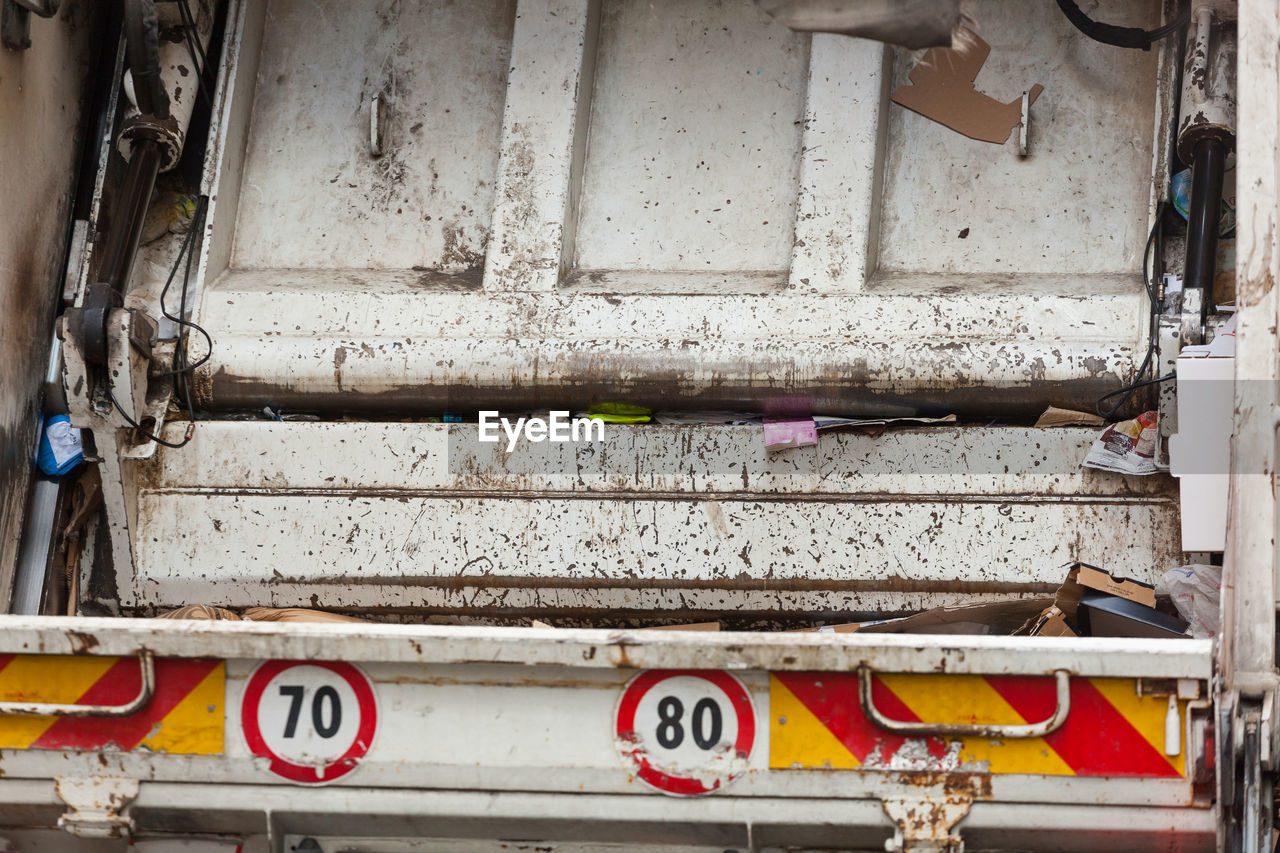 Close-up of garbage truck back view.