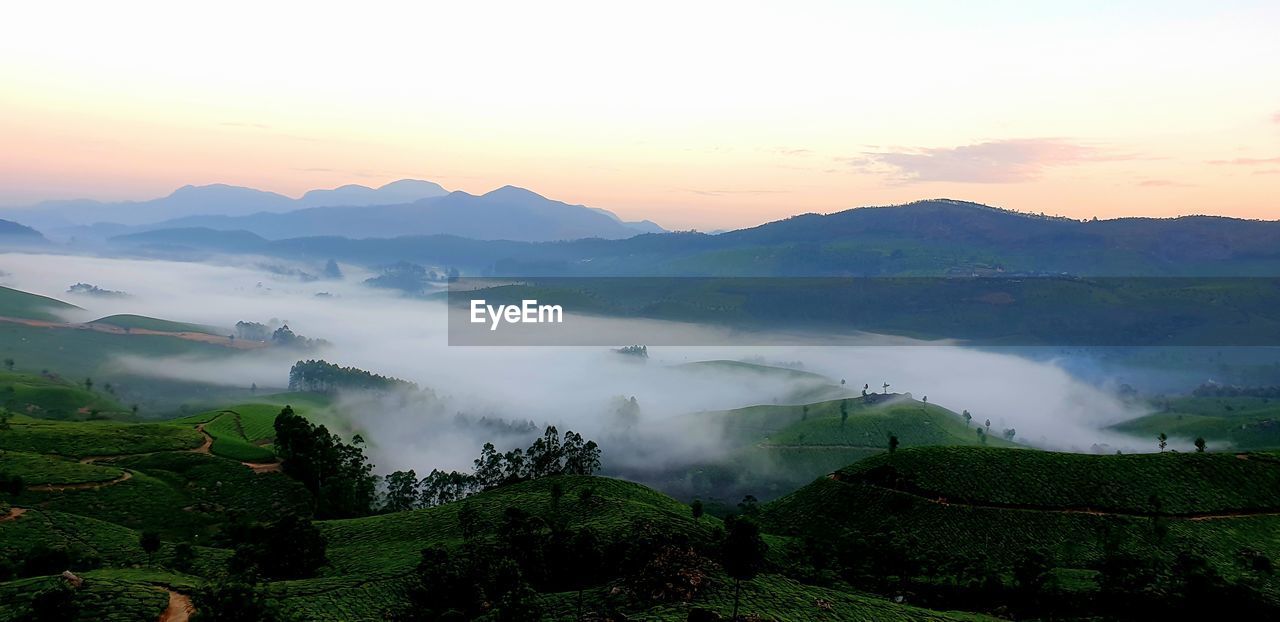 Scenic view of mountains against sky during sunset