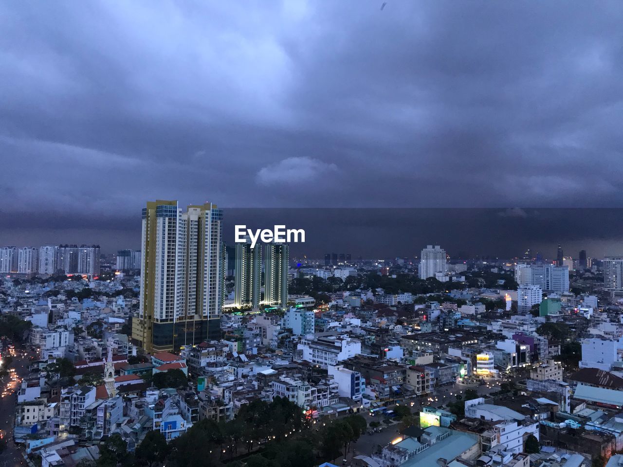 High angle view of modern buildings in city against sky