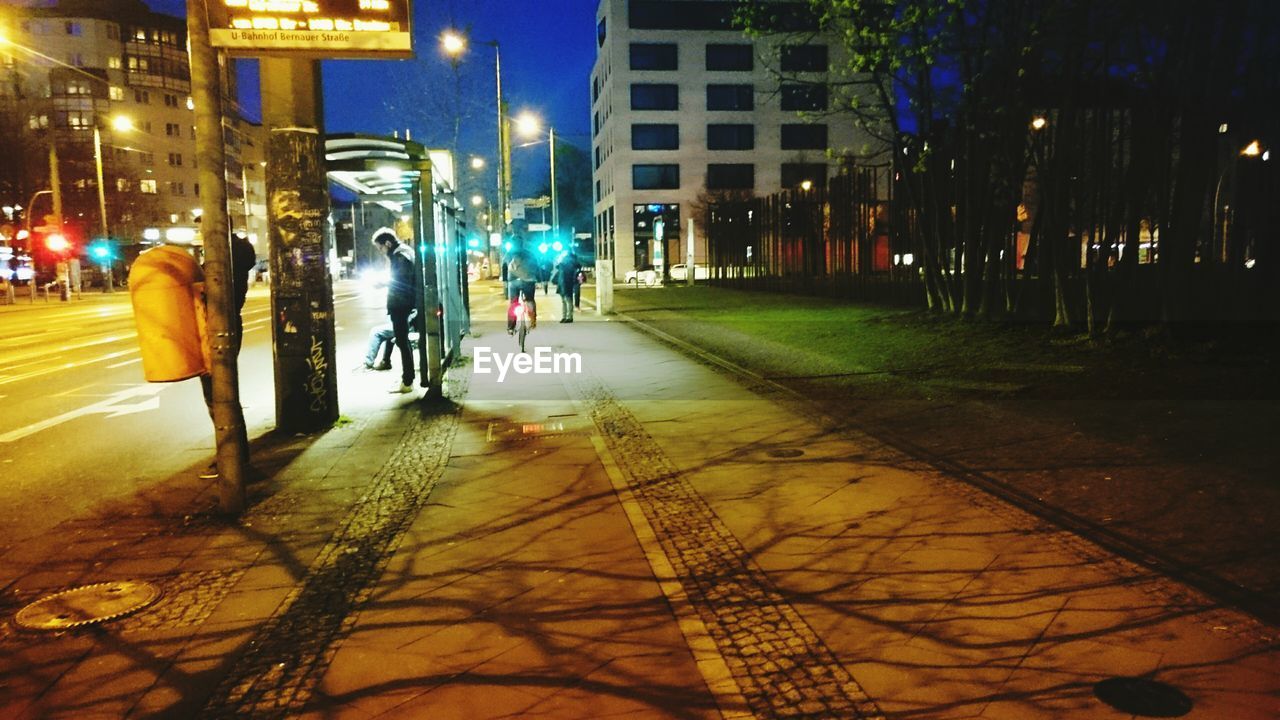 ILLUMINATED CITY STREET AT NIGHT