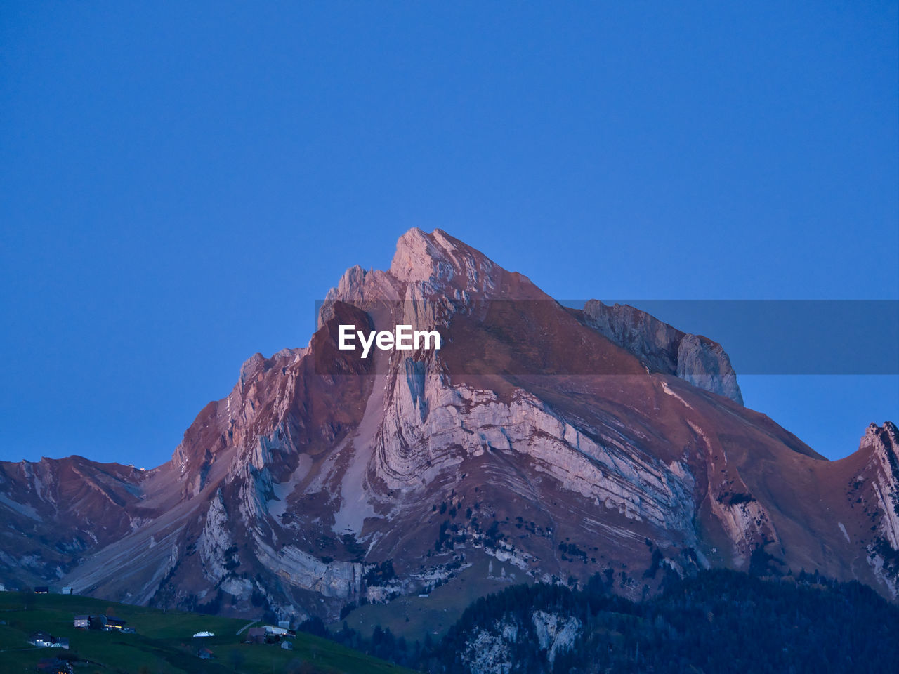 Majestic mountain peak against sky at the blue hour