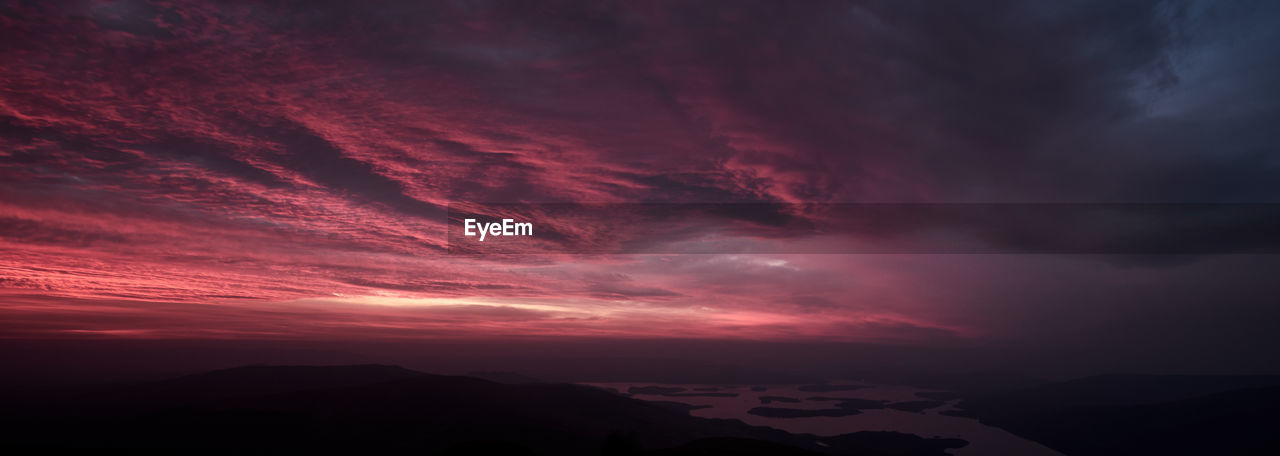 Scenic view of dramatic sky during sunset