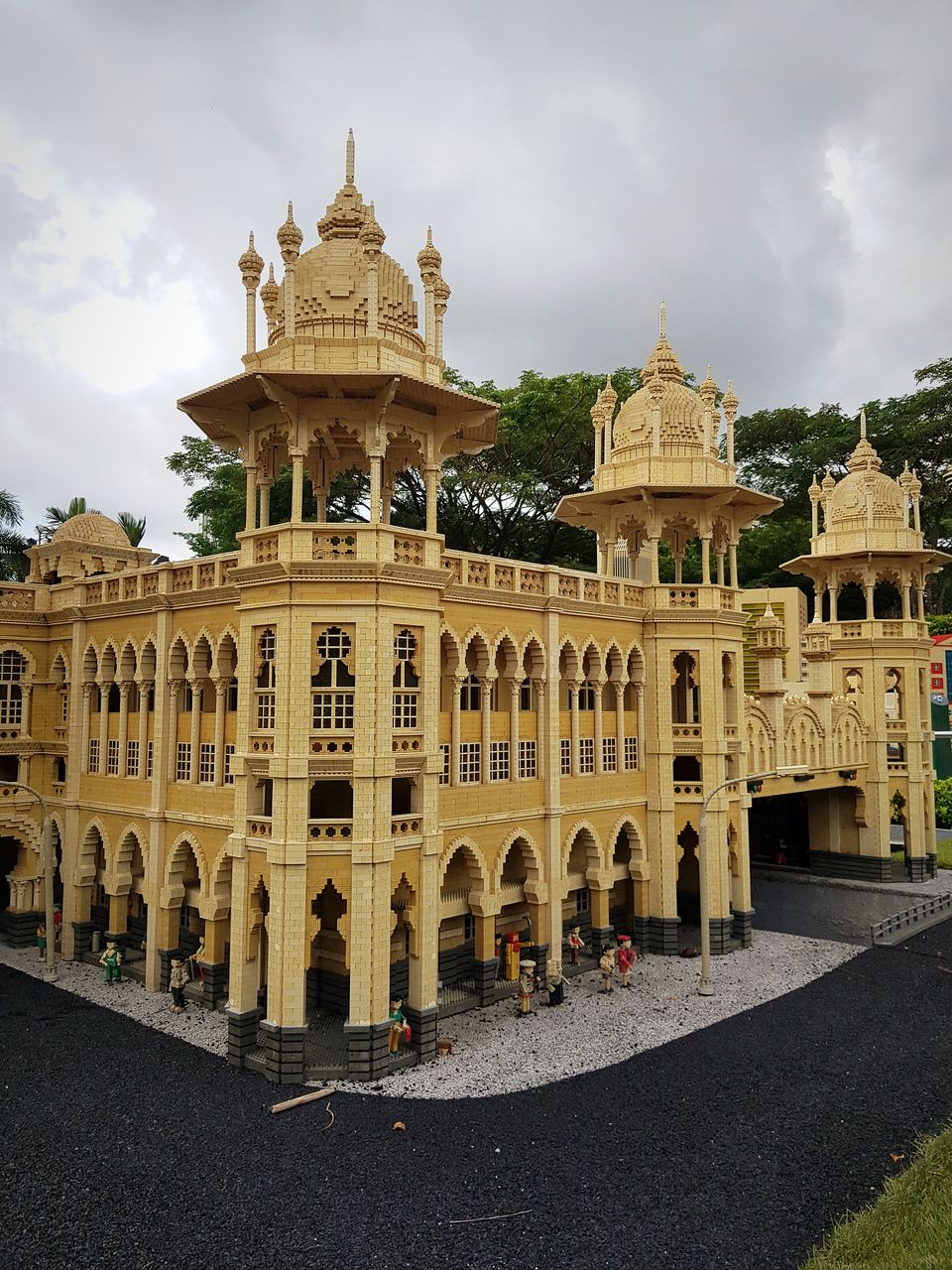 BUILDING AGAINST CLOUDY SKY