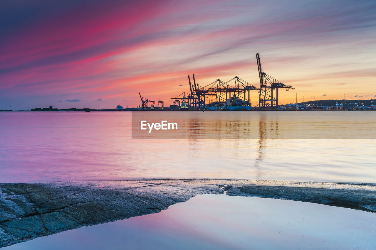 Cranes and ships at sunset, sweden