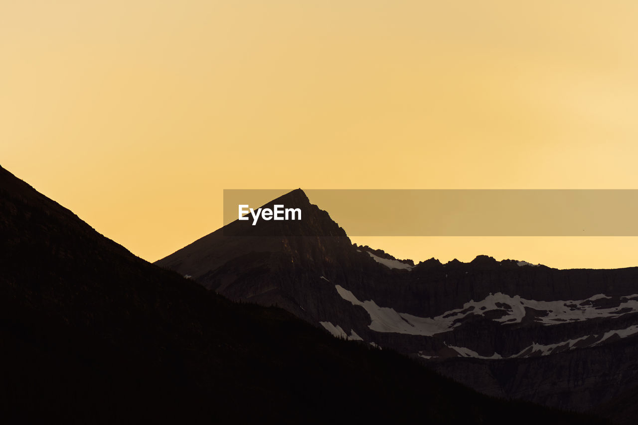 Scenic view of mountains against sky during sunset