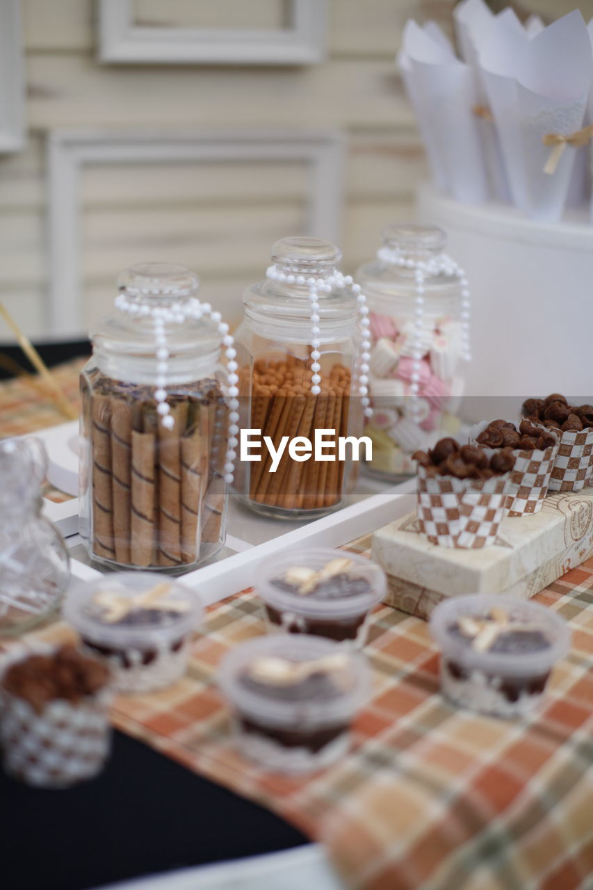 CLOSE-UP OF CUPCAKES ON TABLE AT CAFE