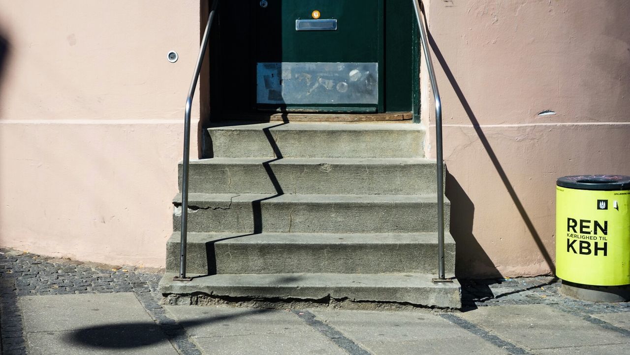 Steps against door of building