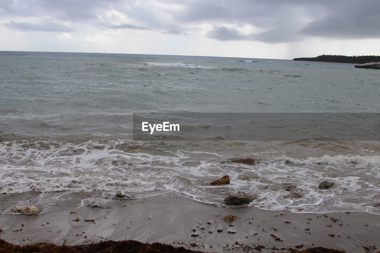 VIEW OF SEA AGAINST CLOUDY SKY