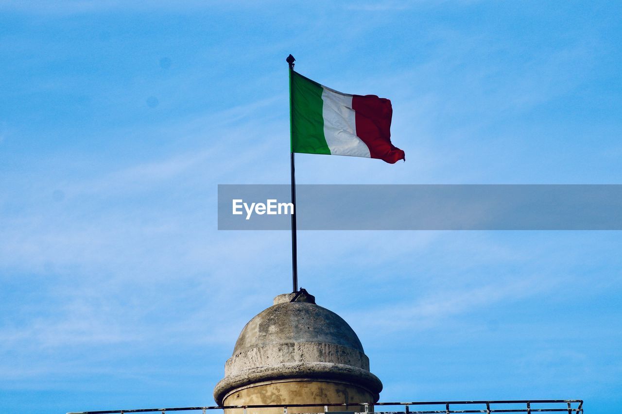 Italian flag on a dome in rome italy