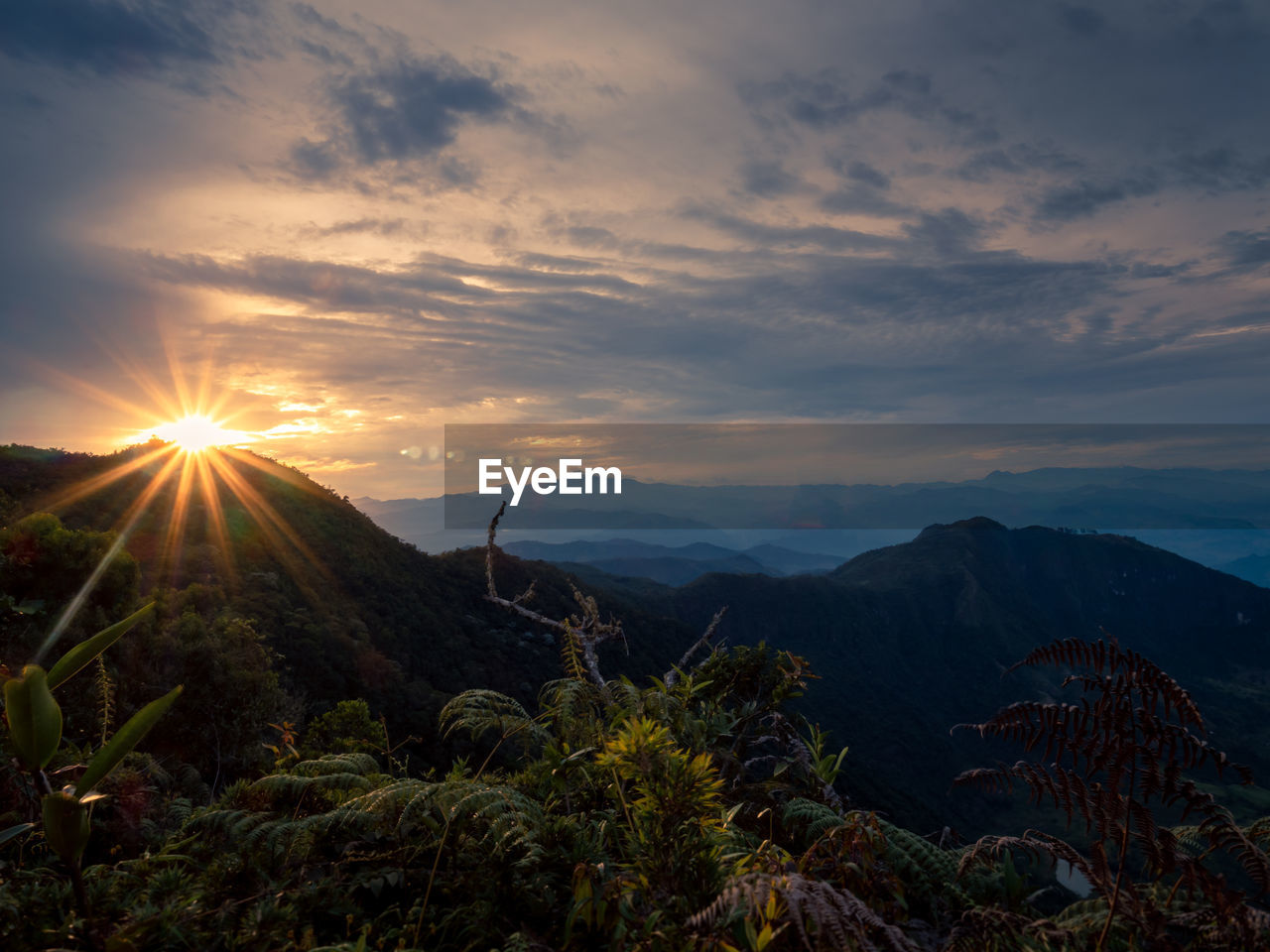 Scenic view of mountains against sky during sunset