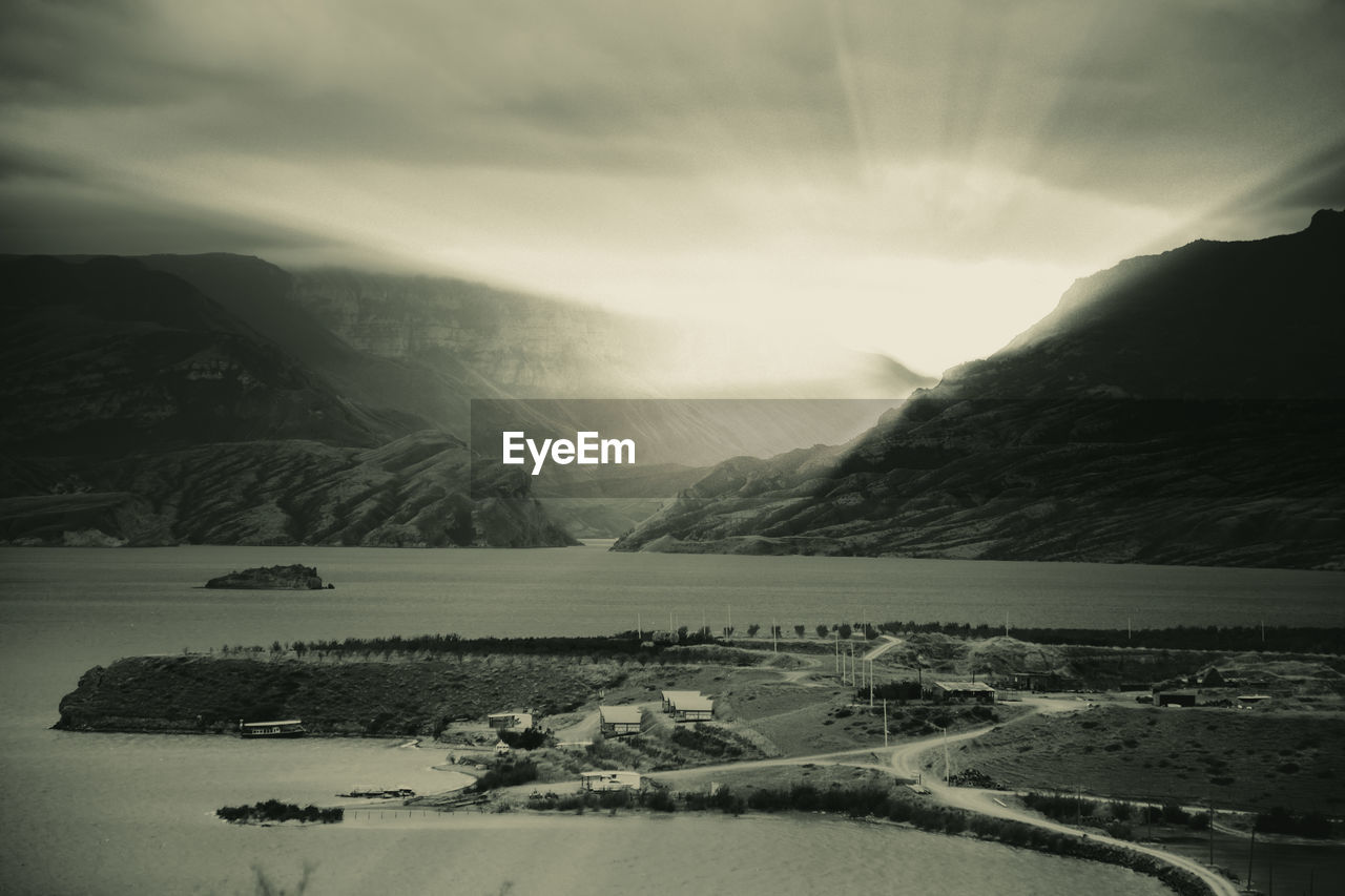 Scenic view of lake against sky during sunset