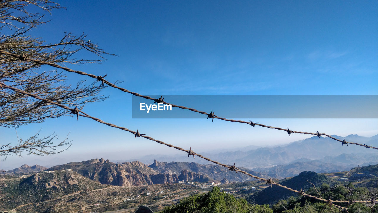 View of barbed wire against sky