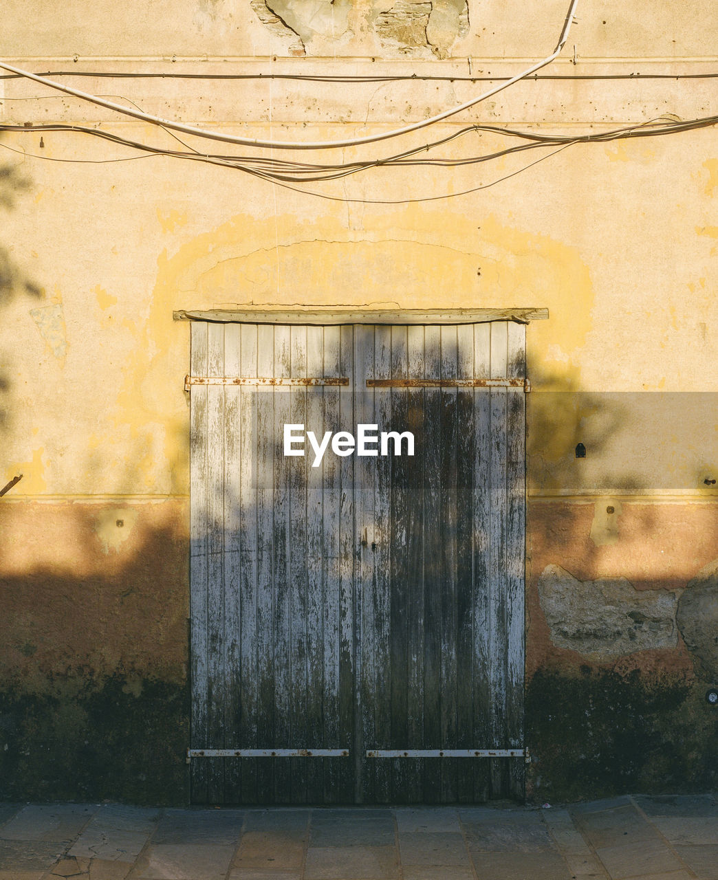 Yellow vintage wall in rural village