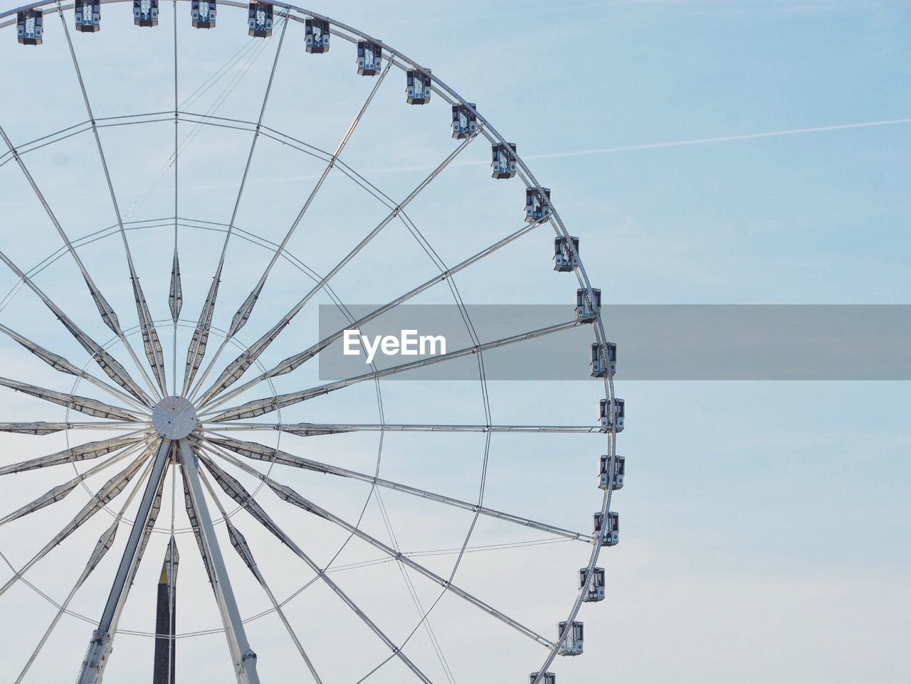 Low angle view of ferris wheel against sky