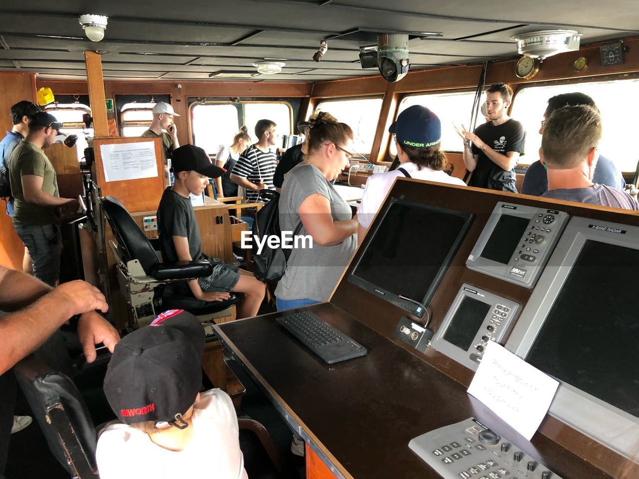 GROUP OF PEOPLE WAITING AT BUS