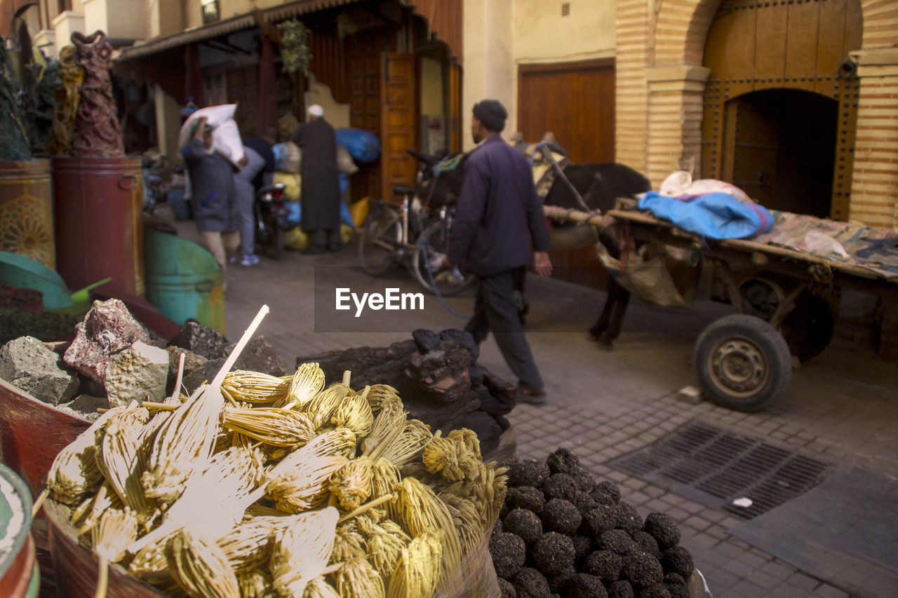 GROUP OF PEOPLE IN MARKET