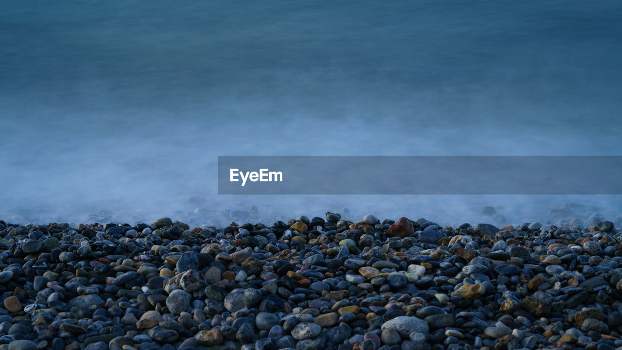Stones on shore at beach