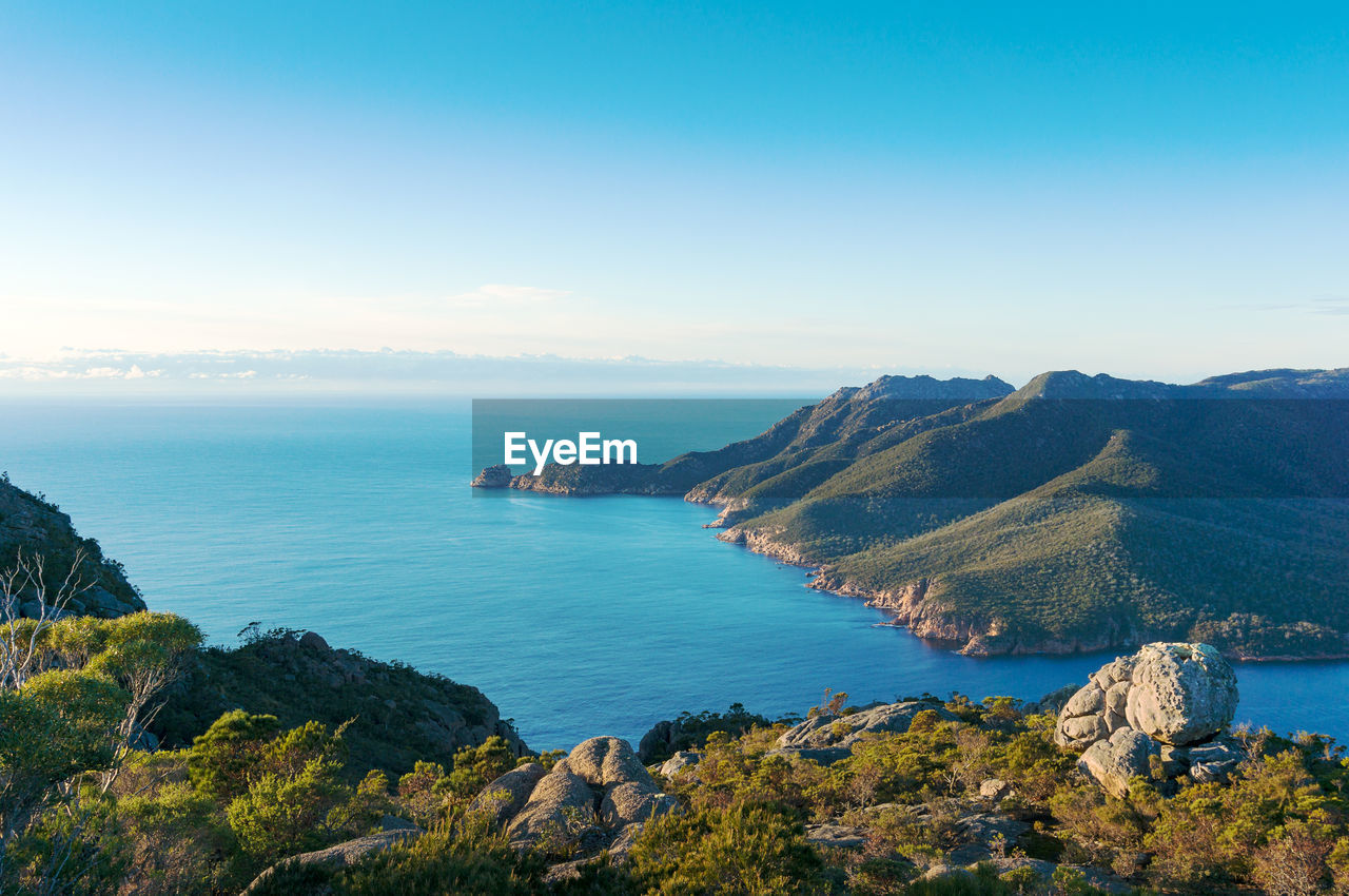 Picturesque seascape view of blue ocean lagoon and mountains. freycinet national park