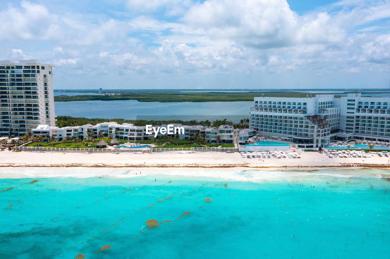 Flying over beautiful cancun beach area. aerial view.