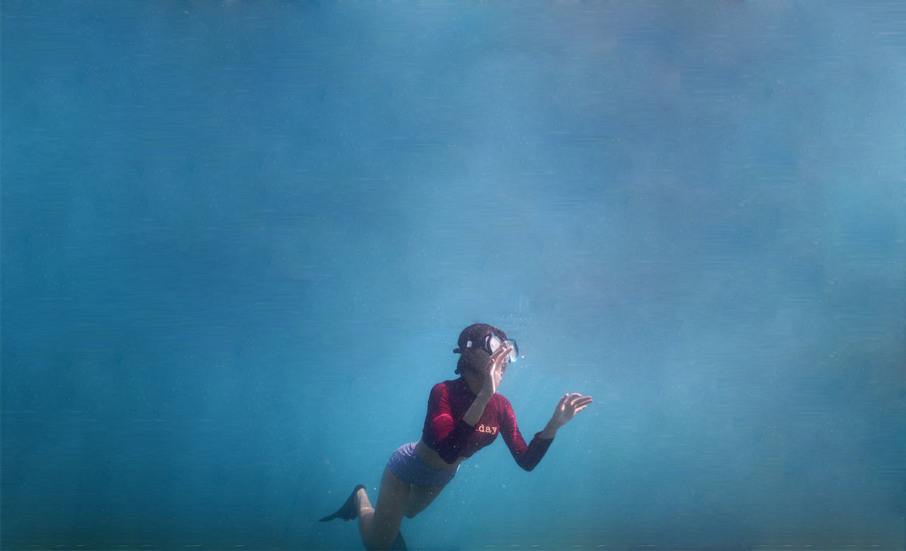 Woman swimming in sea