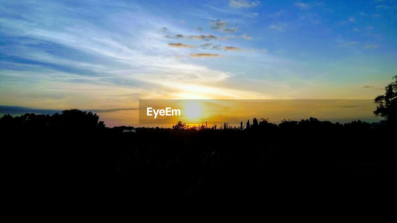 SILHOUETTE LANDSCAPE AGAINST SKY AT SUNSET